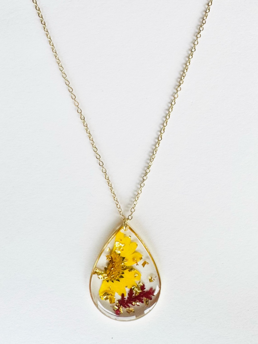 Gold Teardrop Resin Necklace with Yellow Flower
